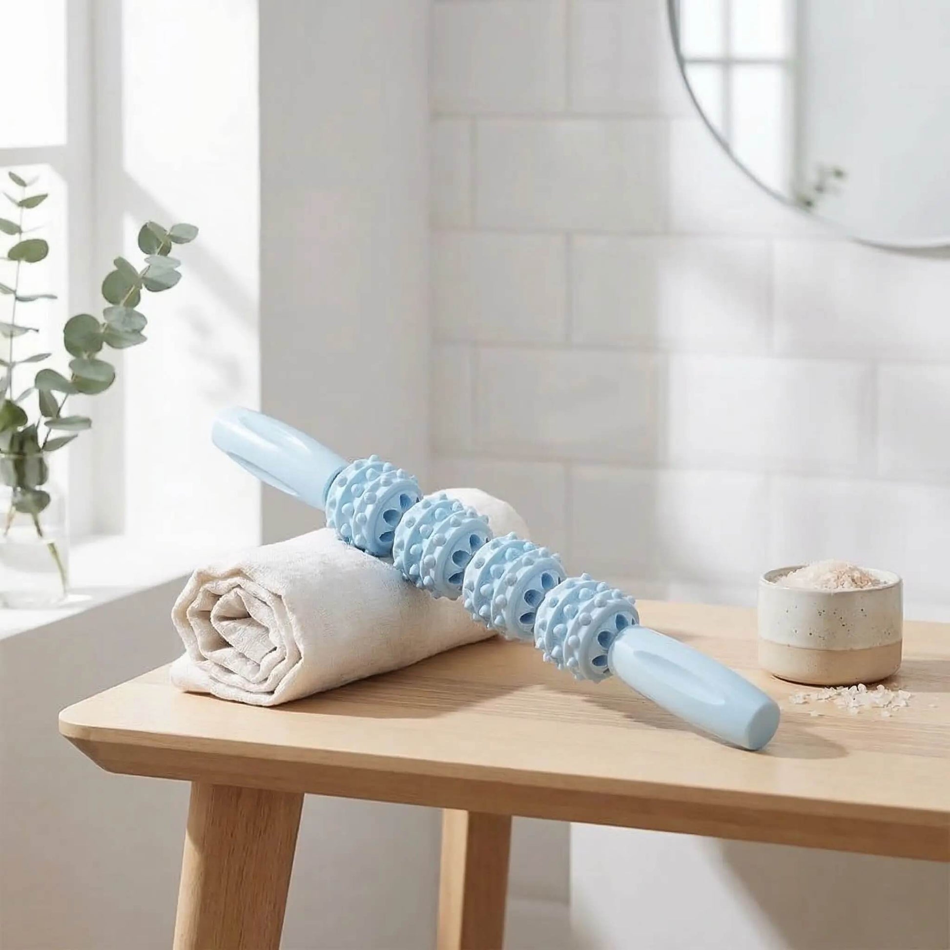 Rouleau de massage baton sur table