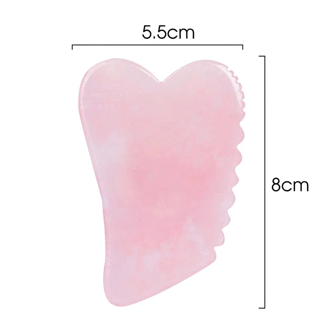 Gua sha en quartz rose à bords dentelés, dimensions 8 × 5,5 cm