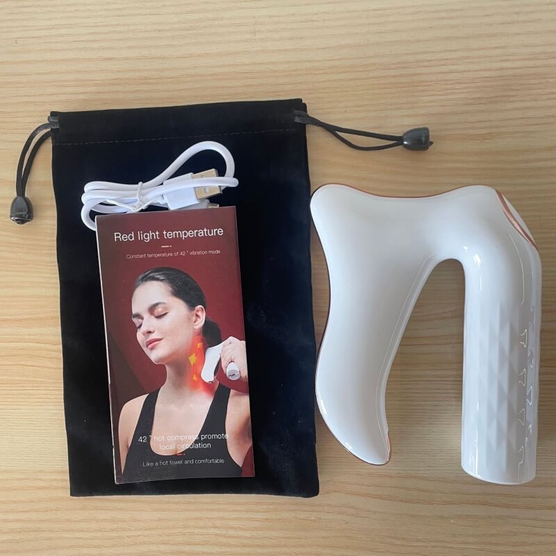 Gua sha électrique avec pochette, câble USB et mode d’emploi